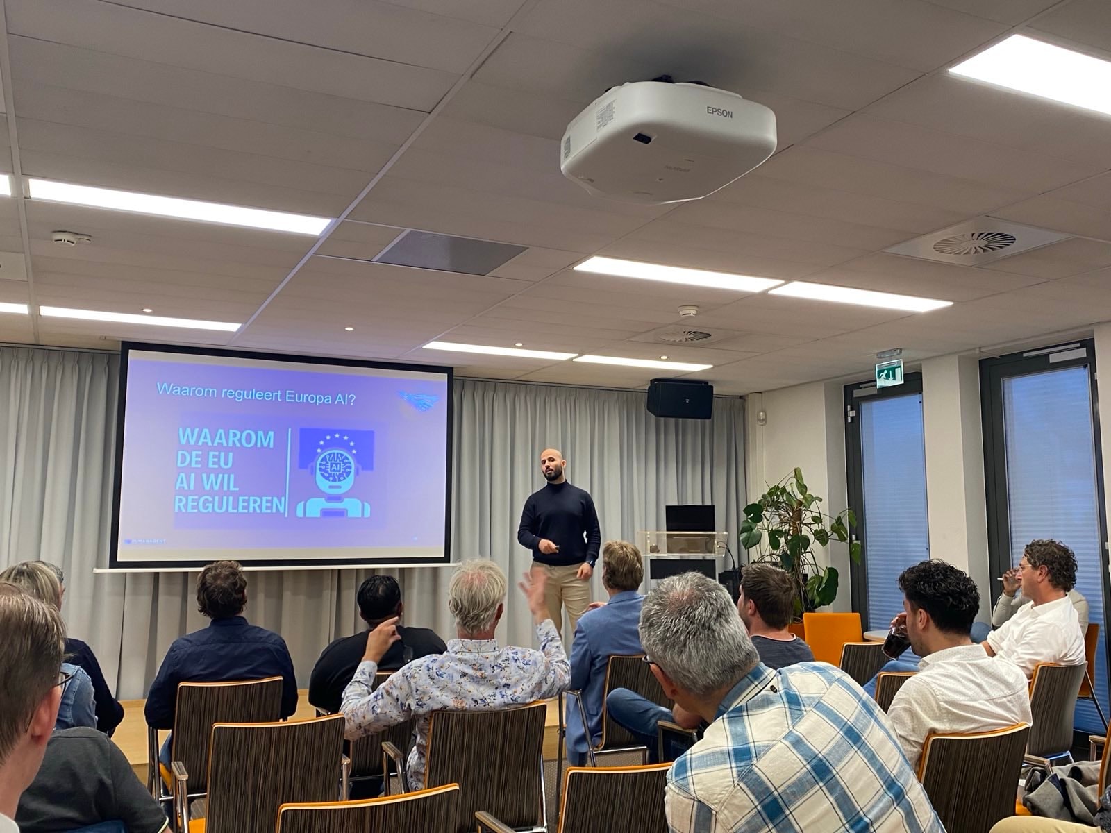 Zahed Ashkara explains why the EU wants to regulate AI at a tech event Zahed Ashkara explains why the EU wants to regulate AI at a tech event